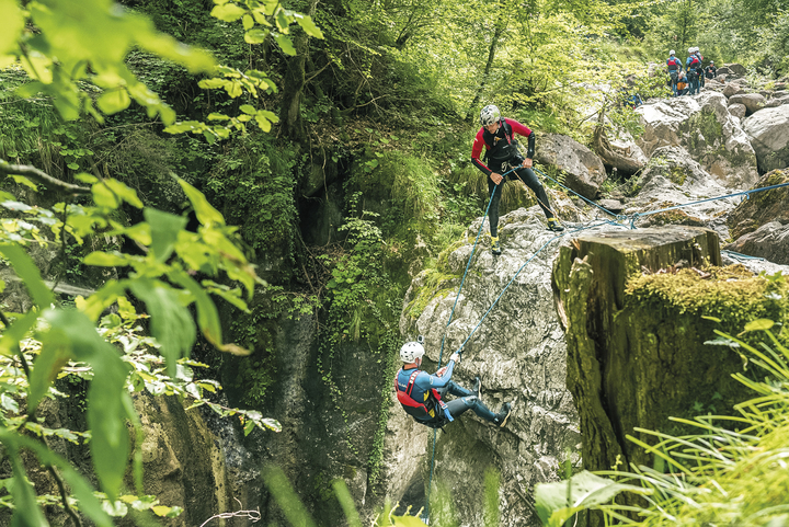 Canyoning-Interlaken_Rappel-001_Switzerland.jpg A canyoning guide lowers a man down a 10-meter rappel at the start of Interlaken Canyon
