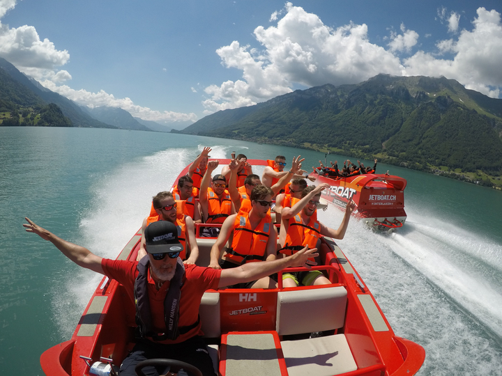 Two Jetboats pass by each other on a sunny summer day on Lake Brienz